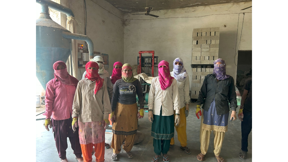 A group photo of women farmers trained by Gohemp, turning agricultural residue into eco-friendly building bricks-TBT