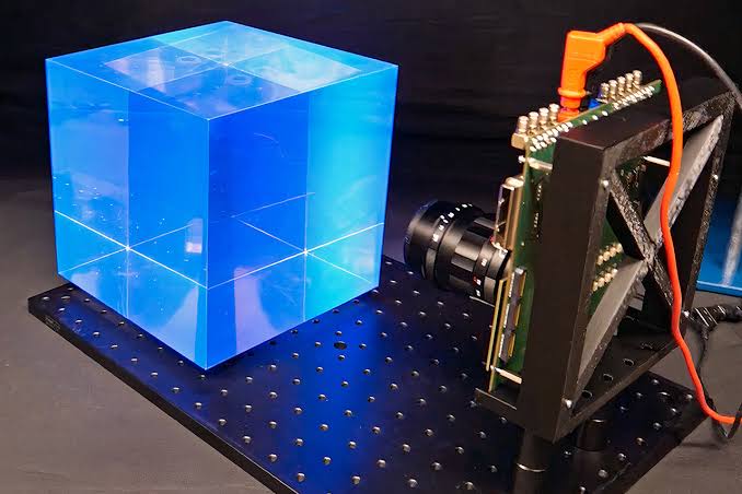 Scientists Develop AI-Powered Camera That Reconstructs Particle Paths Using Just a Few Photons