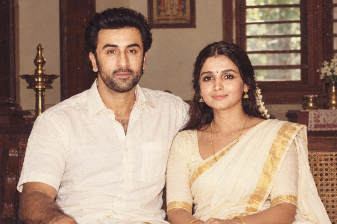 AI-generated image for representational purposes only. The image is a creative recreation inspired by Alia Bhatt and Ranbir Kapoor in a nostalgic 1980s Malayali family portrait style. It is not an actual photograph from the 1980s.